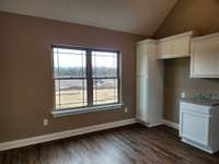 Custom Cabinets and Waterproof Plank Flooring in the Kitchen.