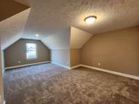 Huge Bonus Room provides space for watching Sports and Movies with Family & Friends. Picture of Similar House.