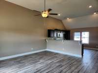 Kitchen features a Granite Bar Top for Serving and additional Dining Space! Picture of Previous House.
