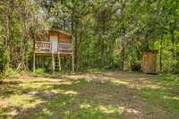 Treehouse with a compost outhouse
