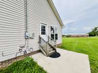 Side steps to patio area and yard