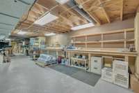 A dream workshop with extensive workbench space, pegboard storage, and built-in organization—ready for hobbies, repairs, or creative projects.