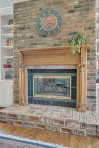 Another beautful fireplace with intricate wood surround, currently enjoyed with gas logs but has the option to be woodburning.