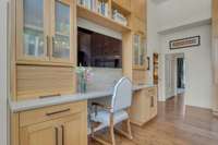 This is the perfect spot for recipe planning, organizing, or homework with a view. Roll front cabinets offer electrical outlets for charging electronics out of eye sight. Open shelves are perfect for cookbooks or displaying chinoiserie & china.