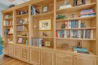 Expansive custom built-ins offer refined storage and display space—perfect for books, décor, and personal treasures.