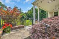 Lush landscaping and dramatic seasonal foliage- the mature arborvitae and japanese maples are sure to be your garden favorites.