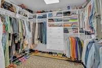 One of two walk in closets offers shelf space and drawers.