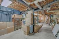 Ample storage or future expansion space abounds. Note the access to water and the new Navien tankless water heater (2020).