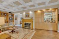 A wetbar is conveniently integrated into the custom cabinetry.