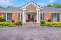 Colonial Revival architectural details add classic timeless style to this stately brick home.