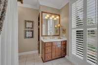 This bedroom enjoys its own private bathroom.