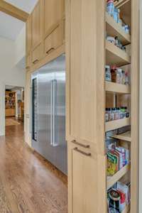 Custom built-ins provide thoughtful storage thoughout. There is a designated space for everything in this kitchen including the spices.