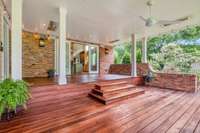 An expansive deck offers year round outdoor living, dining, and entertaining space.