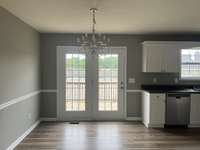 Dining Area off the Kitchen with French Doors leading to the deck