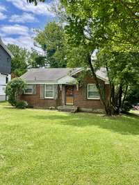 All Brick Cottage is located in the heart of Inglewood on a large lot.