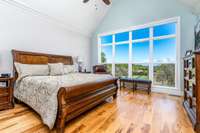 Primary, View, Vaulted Ceiling, Hickory Floors, Ceiling Fan.  Large enough for even California King Beds.