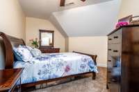 The upstairs bedroom is part of the Mother-in-law/Teenagers suite along with the weight room, upstairs bath and the family room with wet bar.