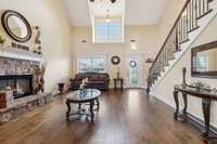 The spacious living room features soaring grand ceilings and gleaming finished hardwood floors. 1107 Sycamore Leaf Way   Murfreesboro, TN 37129