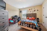 Bedroom 2 features a single window and carpeted flooring. 1107 Sycamore Leaf Way   Murfreesboro, TN 37129