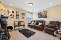 The upstairs loft area features cozy carpeted flooring and a single window that brings in natural light. 1107 Sycamore Leaf Way   Murfreesboro, TN 37129