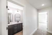 Upstairs bath has double vanity and custom cabinetry!
