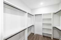 Primary closet is huge with tons of storage, all wood shelving throughout home!