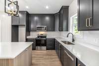 Custom cabinetry to the ceiling, quartz countertops and designer finishes make a statement!