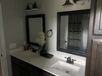 Master bath room with double vanity sinks tons of storage space.