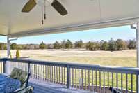 This covered deck with double ceiling fans is the perfect place to relax!