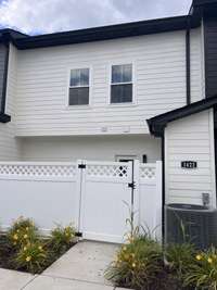Private entrance from the parking area behind the townhouse.