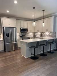 Stainless Steel appliances stay including Refrigerator, stove, microwave and dishwasher.