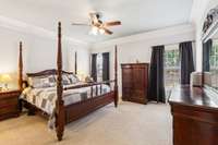 Large primary bedroom located downstairs at back of house