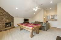 Stone Fireplace with Gas Logs highlight the corner of the Bonus Room