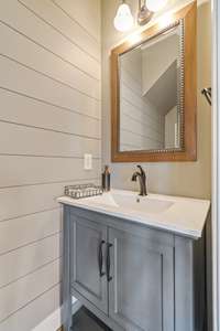 1st Floor Powder Room with furniture sink vanity