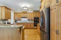 Granite Countertops, double oven, cabinet pantry plus a walk-in pantry