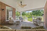 What a relaxing Covered Porch! Enjoy the privacy of the backyard