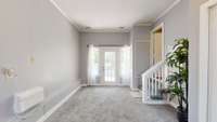 Den overlooks the large back yard and offers custom closets for additional storage