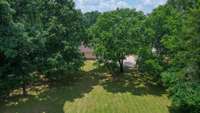Property is surrounded by beautiful, mature trees