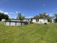 BACK OF HOME WITH POOL