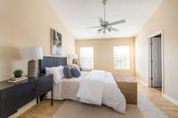 The primary suite offers a large walk-in closet & full bath.