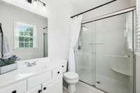 This 2nd bedroom has an easy entry walk-in shower.