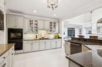 Double ovens, under cabinet counter lighting and so much storage in this kitchen.