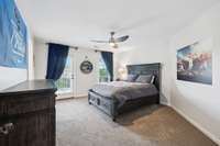 Bedroom 3 (and there are 3 bedrooms upstairs). This bedroom has a door that leads out onto the top front balcony .
