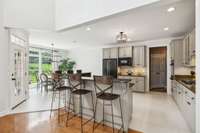 Barstools at the bar and table in the breakfast nook make this area so easy to entertain.