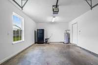 Garage offers a brand new window, plenty of room for all of your toys... AND a garage fridge that will remain if you choose. Could be used as a home gym...