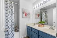 Double sinks and plenty of drawer space in the vanity inside of your master bathroom