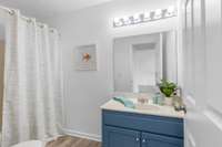 Large bathroom at the end of the hallway located between the two secondary bedrooms