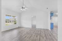 Natural lighting fills the room ... from this view you can peek into the master bedroom while you are standing in the hallway leading to your secondary bedrooms and your secondary bathroom.