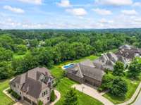The home backs up to a lovely tree line, providing privacy in the backyard area.