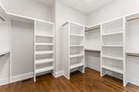 The primary closet has custom shelving and plenty of space.